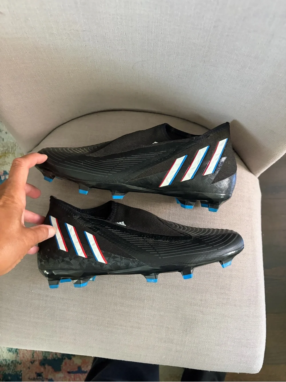 adidas Men’s Black Soccer Cleats with Blue and Red Trim